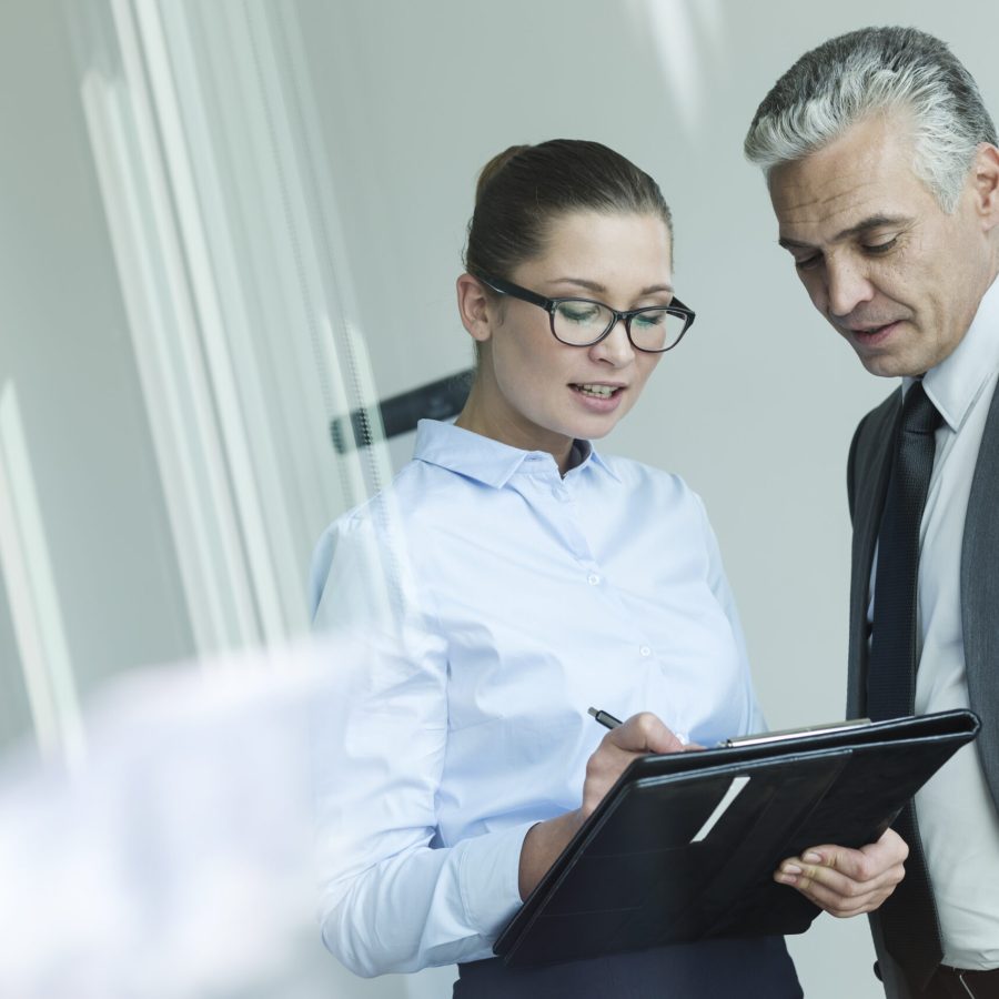 Manager discussing with assistant